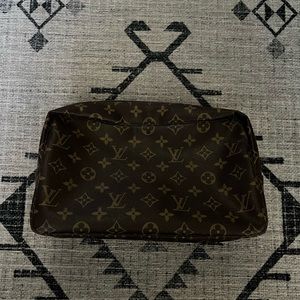 Louis Vuitton toiletry pouch. Excellent condition outside, tears inside.